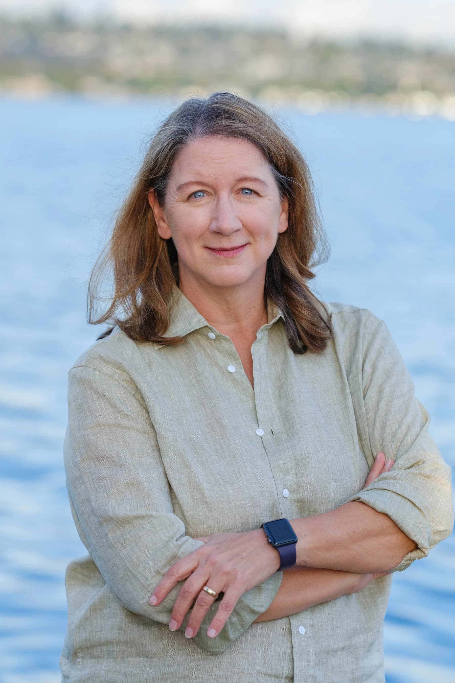 Angela Thyer standing beside the water